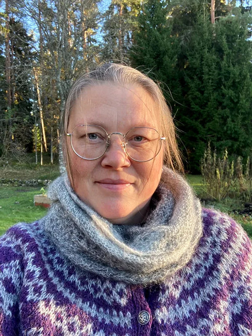 Emma Lejbro in a knitted scarf outdoors