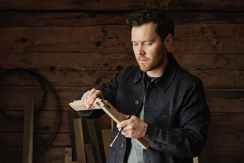 Fredrik Ireklint in his workshop with a wooden workpiece