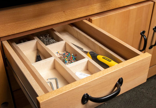 Sjöbergs small parts trays in an open cabinet drawer